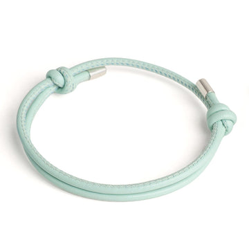 Mintgruenes Lederarmband mit verstellbarem Knoten und silbernen Metallenden